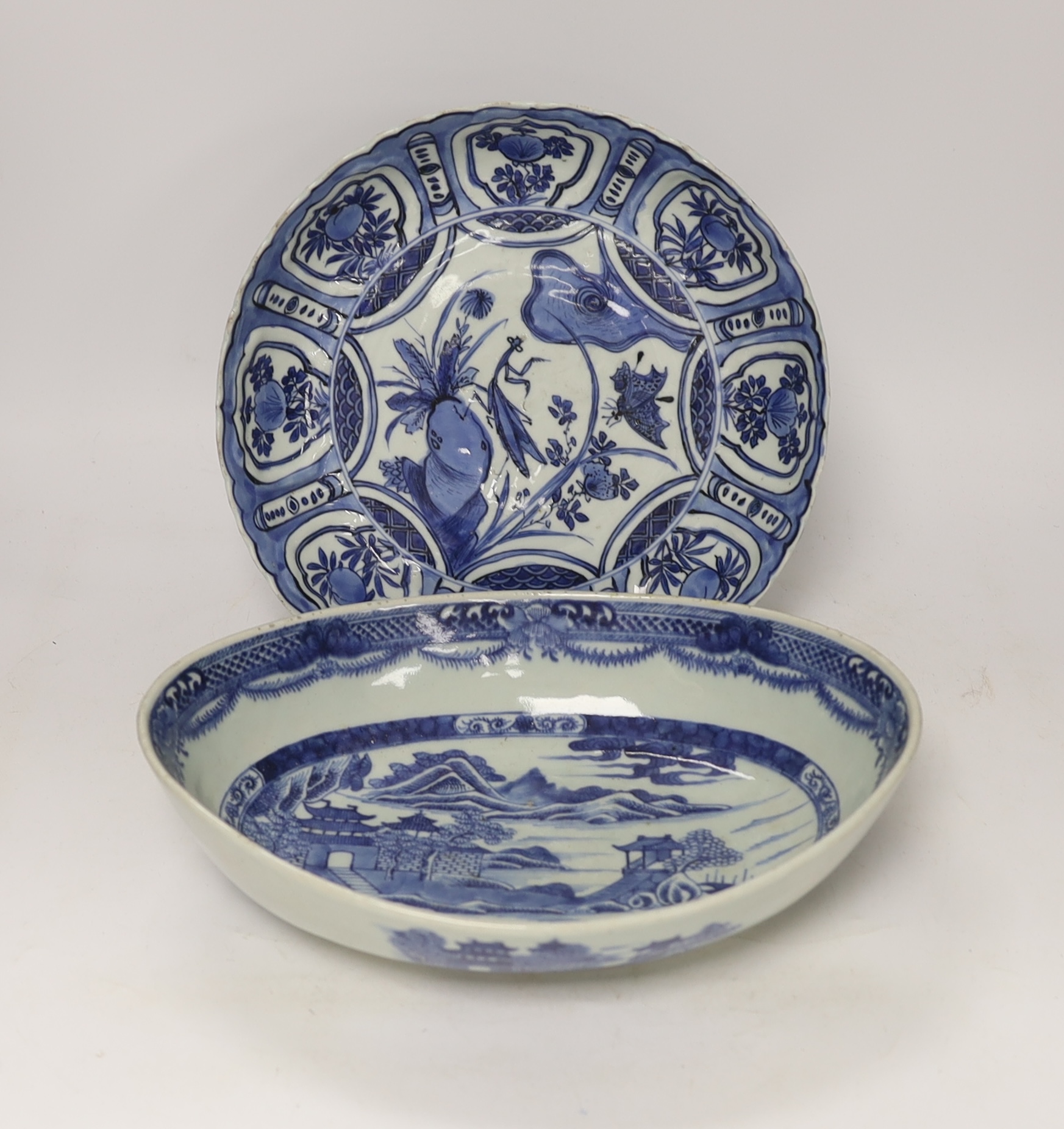 A Chinese Ming blue and white ‘praying mantis’ and butterfly dish, early 17th century, and a Chinese export oval serving dish, c.1820, 29cm